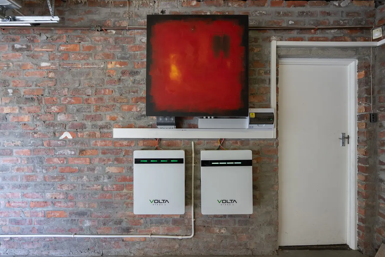Two wall-mounted backup batteries in the garage