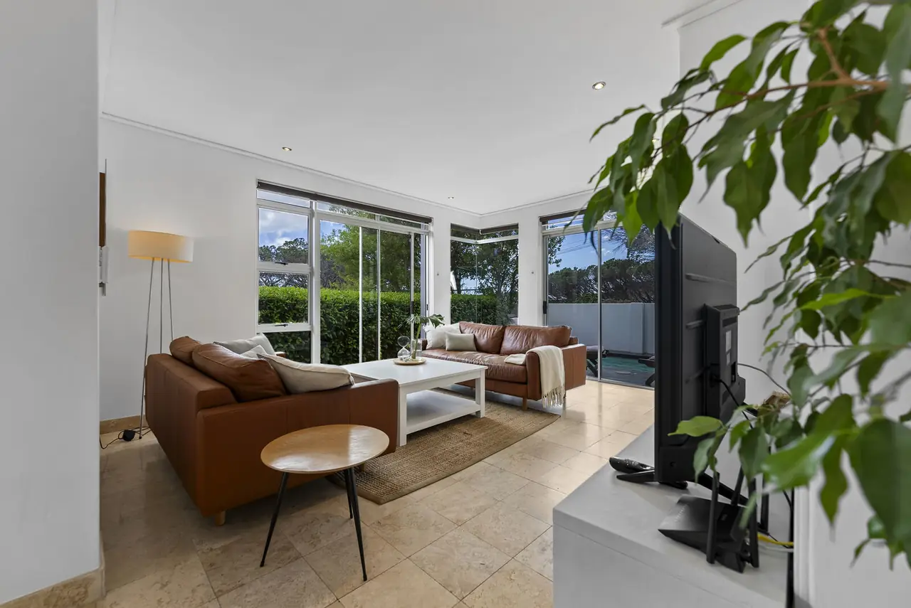 Lounge with leather sofas opening onto the pool deck, Camps Bay holiday house